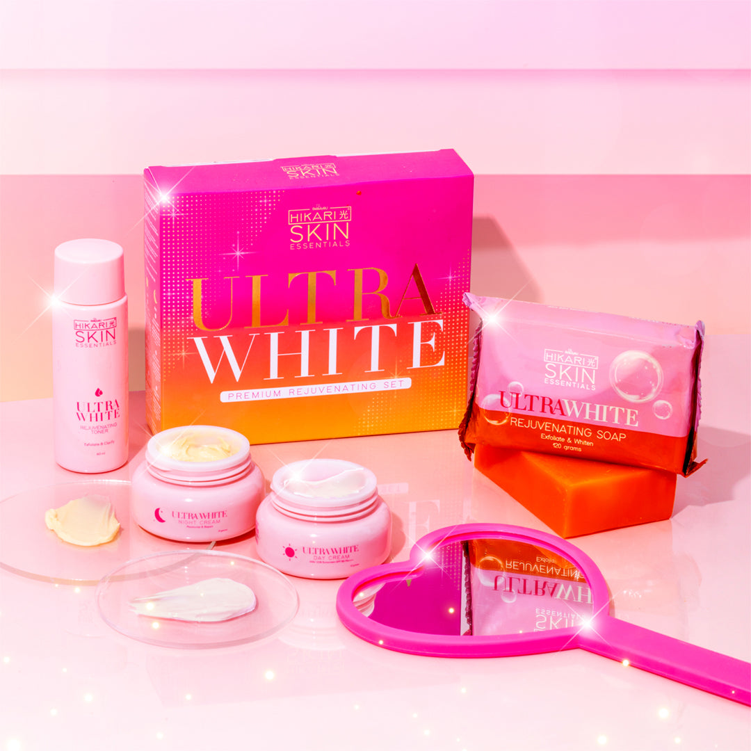 Skincare products with 'Ultra White' packaging on a pink background
