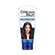 Cream Silk Damage Control hair conditioner tube on a white background