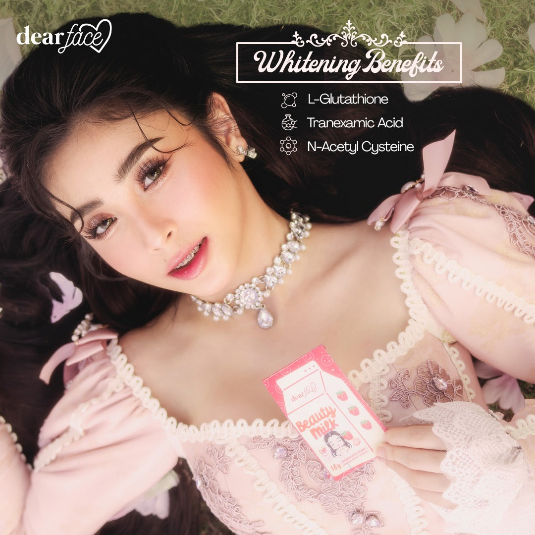 Woman in a pink dress with a necklace, lying on a floral background with 'dearface' branding.